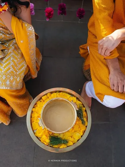 A close up of the Haldi ceremony, a ritual full of color, tradition, and blessings for the couple's new beginning.