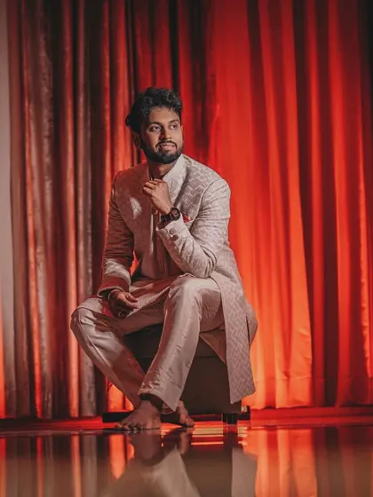 An artistic shot of the groom, titled 'Illuminati', using creative lighting for a high-fashion look.