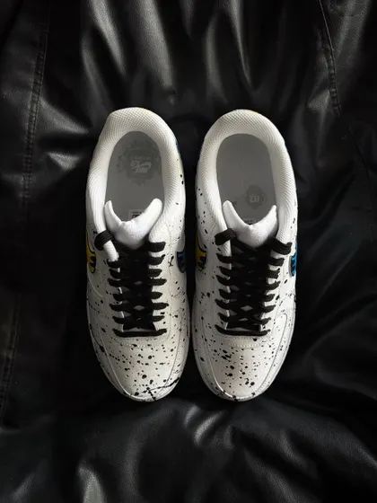 A top-down view of the dual-color drip custom sneakers.