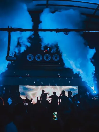 Blue CO2 jets creating a dramatic effect on the dance floor. I use colored lighting with the smoke to match the mood of the track.
