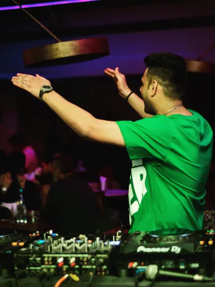 Arms open wide, embracing the energy of the room. This is the connection I strive to build during every single set.