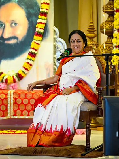 My sister, Bhanumati Narasimhan, speaks at an event celebrating our foundation day. Her presence and guidance in leading satsangs and pujas are an integral part of our community's spiritual life.