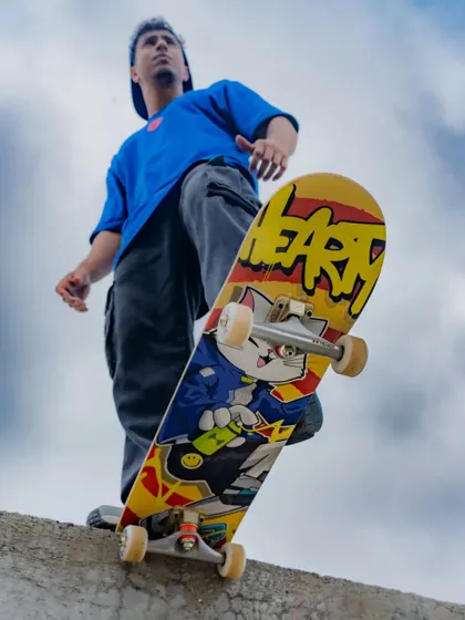 A low-angle shot from the Hearty photoshoot, making the skateboard deck the hero. The design is meant to inspire skaters to push their limits.