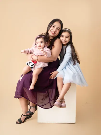 A mother and her two girls. We capture the special bond between mothers and their children at every age.