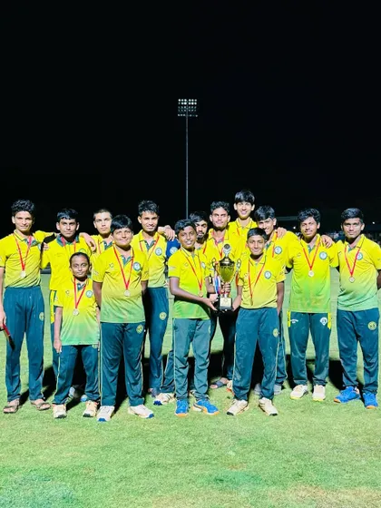 The victorious RSCA U-17 team celebrates with their trophy after winning the Spirit Cup 2024 against SST Cricket Academy, Chennai, in a floodlit final.