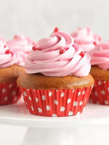 A delightful array of our Strawberry Cupcakes, with fluffy vanilla sponge and swirls of pink strawberry buttercream. They are a simple, joyful treat that everyone loves.