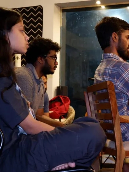 Diploma students listening intently during a class on live performance and improvisation.