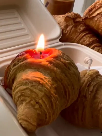 Is this a real croissant? Nope, it's a candle! This hyper-realistic croissant candle is a quirky and fun addition to any breakfast table setting.