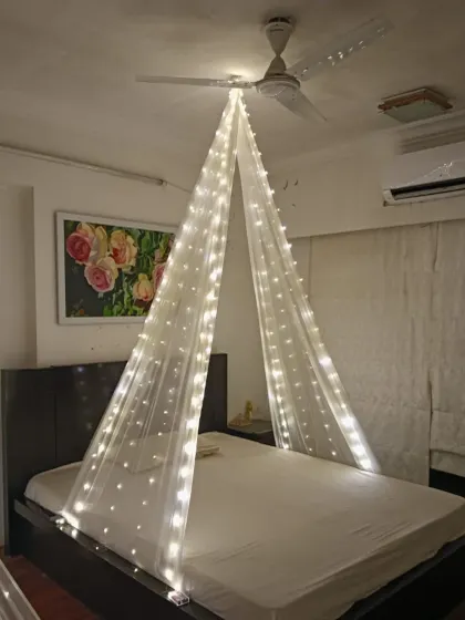 A simple yet beautiful bedroom transformation. I used a canopy of sheer fabric with fairy lights to create a dreamy and romantic space for a special occasion at home.