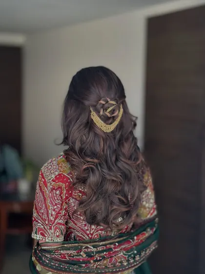 A side view of the rose-braid half-updo, showing the intricate detail of the hairstyle.