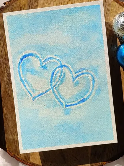 A closer look at the snowy hearts painting. The texture of the gouache gives the hearts a slightly raised, almost icy look.