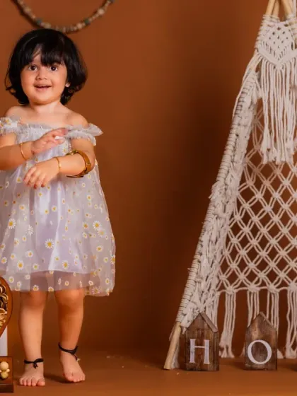 A happy two-year-old in our boho-themed teepee setup. This versatile set works beautifully for birthdays of all ages.