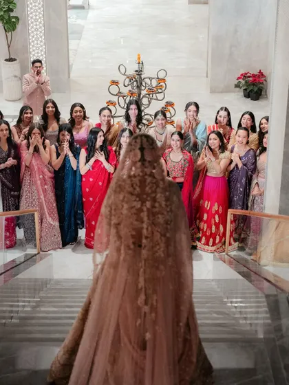 The first look, not with the groom, but with her bridesmaids. The raw emotion and excitement on their faces as they see the bride for the first time is a beautiful story in itself.