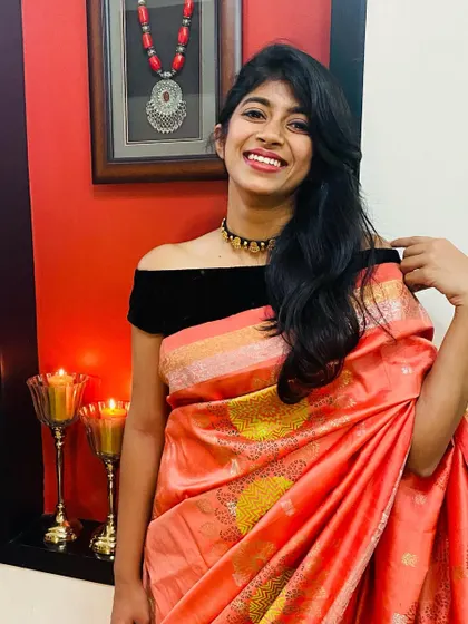 A joyful shot of my daughter in the revamped orange Kanjeevaram. It’s a perfect blend of old and new.