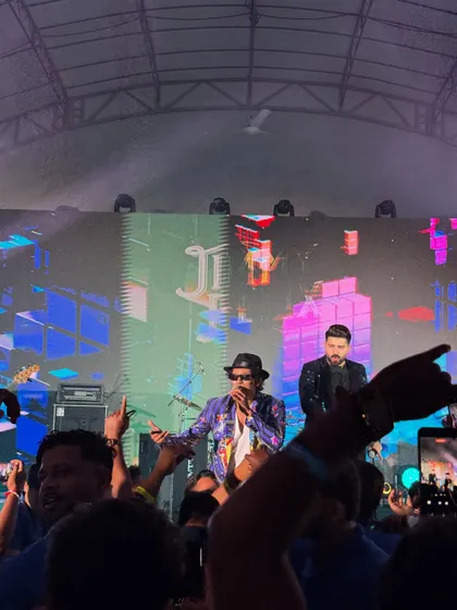 On stage in Singapore, bringing my signature style to an international corporate audience. The energy was just as wild as back home.