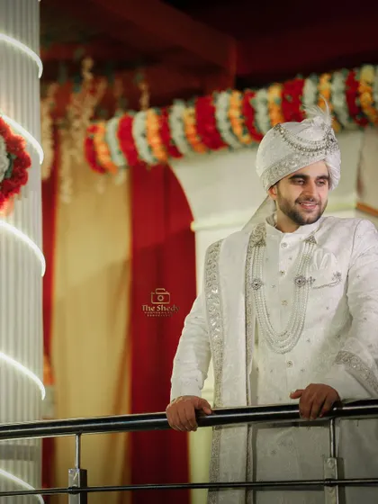 A happy and candid-style portrait of the groom, Tayab Ahmad, smiling during his wedding ceremony. We capture the joy of the groom just as much as the bride's.