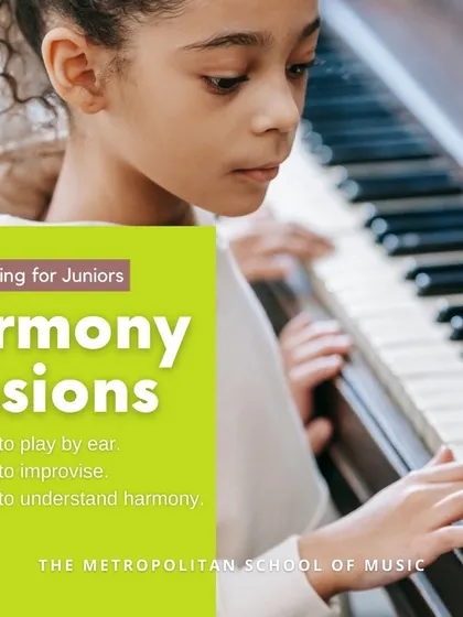 Our Harmony Sessions for juniors focus on core musical skills like playing by ear, improvisation, and understanding harmony. This image shows a young girl focused on her piano practice.