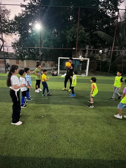 A multi-sport party in full swing, with kids learning a new game from our energetic coaches.