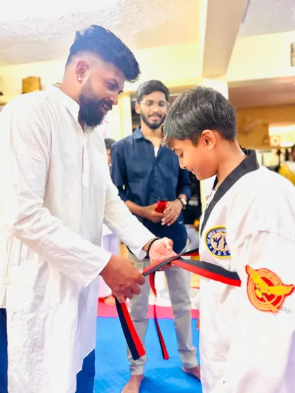 A proud moment for this young black belt candidate.