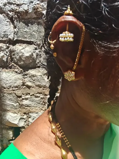 The traditional 'bugdi' earring of a local lady in Kallur village. My travel logs often focus on these small but significant details of adornment, costume, and culture that tell a larger story.