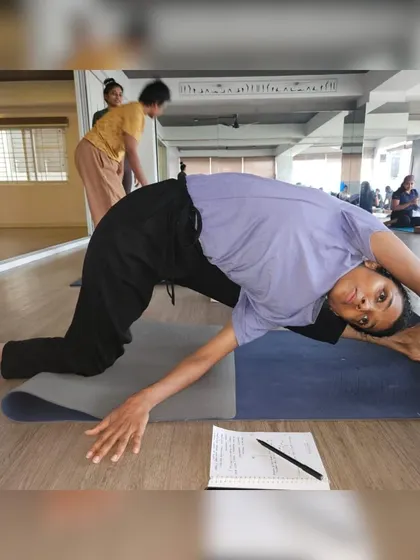 Can you guess this empowering yoga pose? It's a fun way to test your asana knowledge. Hint: it's a deep hip and shoulder opener.
