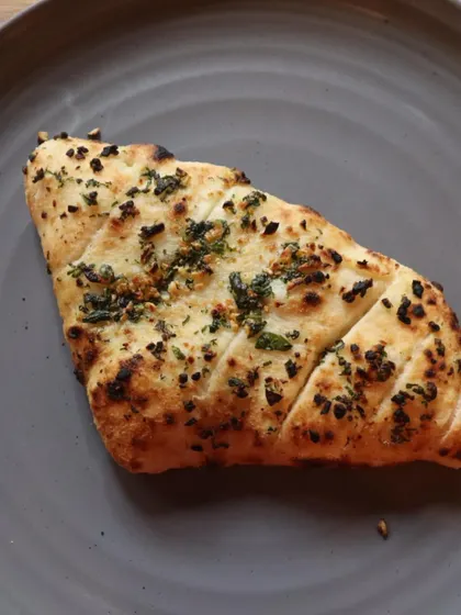 My wood-fired garlic bread is made from the same fresh dough as my pizzas. It's baked with garlic and herbs until it's golden and crispy on the outside and soft on the inside.