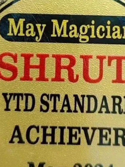 A close-up of the 'May Magician' YTD Standard Achiever medal. This was awarded for exceeding performance targets, a goal I now set for achieving client objectives.