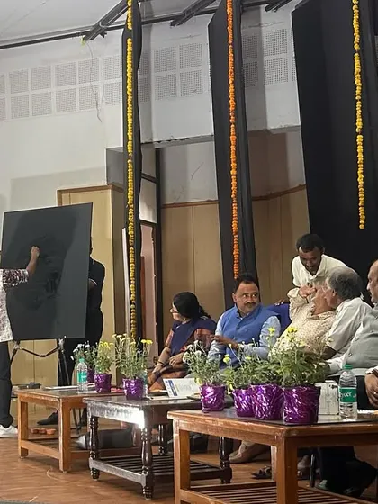 A wide shot of my live painting setup at the Viksit Bharat Youth Parliament. Performing for an audience of dignitaries and students is always a special experience.