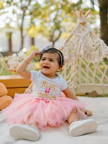 A sweet, candid moment from the birthday picnic. The soft, natural light of an outdoor shoot creates such beautiful, warm images.