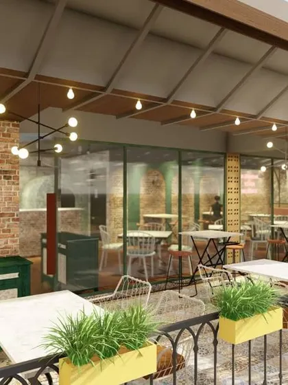 This render focuses on the facade and entrance to the patio, highlighting the use of planters and varied lighting to attract passersby on a busy street.
