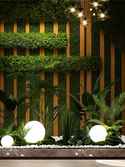 This indoor green installation in Ramnagar uses a combination of a vertical garden and floor planters with integrated lighting. The spherical lights create a magical, glowing effect among the plants.