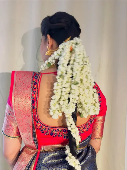 The hairstyle for Gulista's wedding day. A traditional braid adorned with fresh jasmine flowers, which not only looks beautiful but also adds a lovely fragrance.