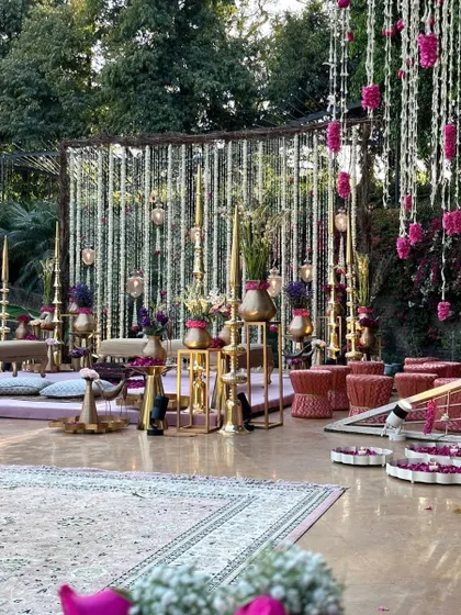 A wider view of the lavender vedi, showing the intricate setup with a Persian rug and low seating for an intimate ceremony.