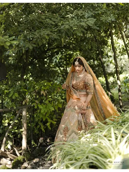 A bride in a sun-dappled forest in Italy. This portrait feels magical and secluded, like a scene from a fairy tale.