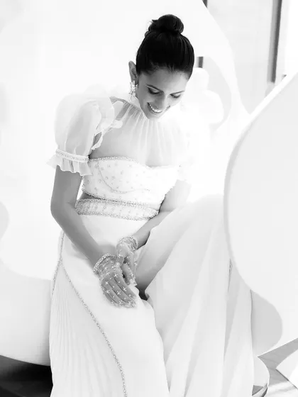Moonlit elegance. For a 'starry night' themed event, we went against the grain with this ethereal white ensemble from Sabina Bilenko. The puff sleeves and delicate details gave it a celestial, dreamy quality.