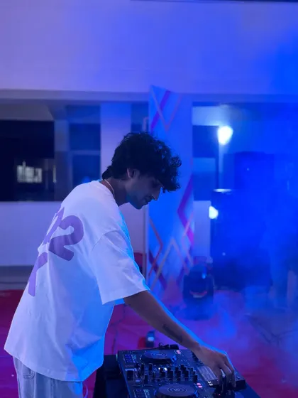 As the set progressed, the lights shifted to a cool blue. The combination of smoke and colored lighting helped transform the space into a true rave environment for the students.