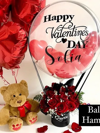 Perfect for Valentine's Day, this hamper includes a teddy bear, a box of red roses, and a personalized hot air balloon. It’s a complete package of love.