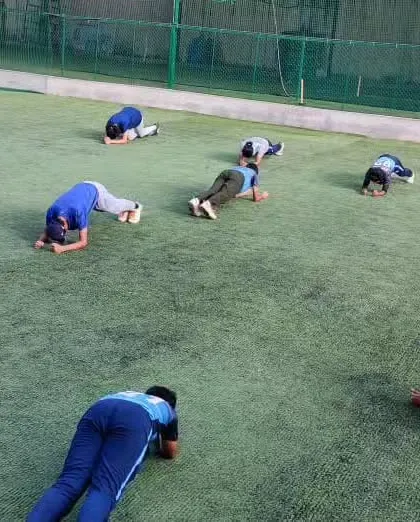 Core strength is the foundation of a powerful athlete. Our U-14 team works on planks and other core exercises, building stability and endurance.