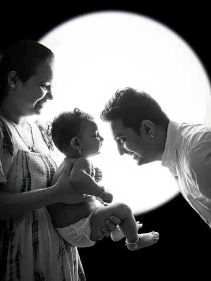 A black and white version of the backlit family portrait. The lack of color puts all the emphasis on the shapes, emotions, and the story being told.