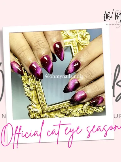 It's officially cat eye season. This design features a deep purple and black cat eye effect, creating a mysterious and glamorous look perfect for the winter months.