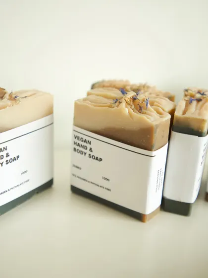 A close-up of the packaging process, showing the simple, clean labels.