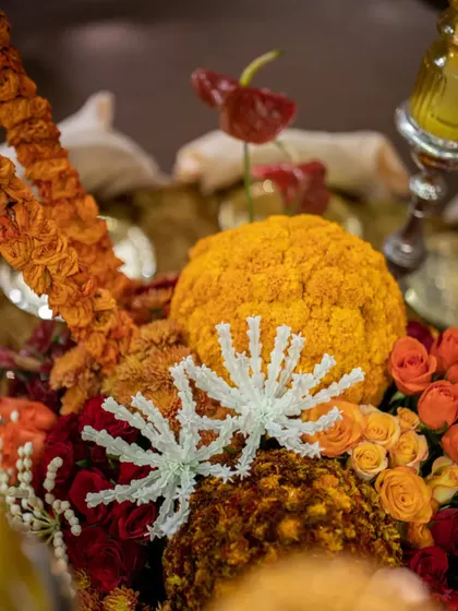 Another close-up of the marigold and jasmine details, showcasing the precision and artistry of our floral artisans.
