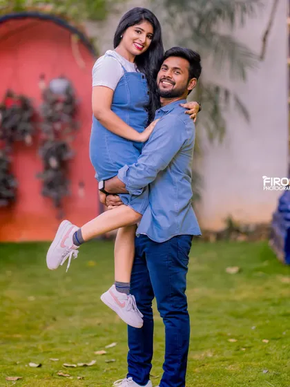 A joyful and energetic lift in a beautiful garden. This shot is full of happiness and captures the fun-loving spirit of the couple.