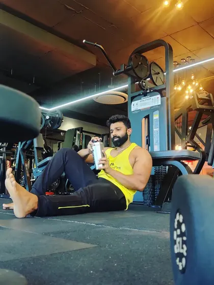 Taking a moment to refuel and refocus. Even during rest periods, the mind is on the next set.