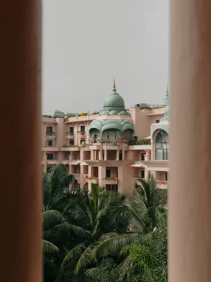 A glimpse of The Leela Palace in Bangalore, framed between pillars. I often look for unique perspectives to capture the architectural beauty of a venue.