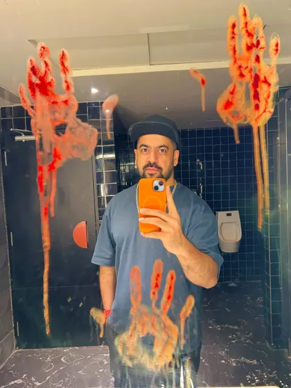 A bathroom selfie with the spooky, bloody handprints on the mirror. The decor was everywhere.