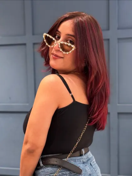 A playful shot showing off the vibrant tones of this red hair colour.