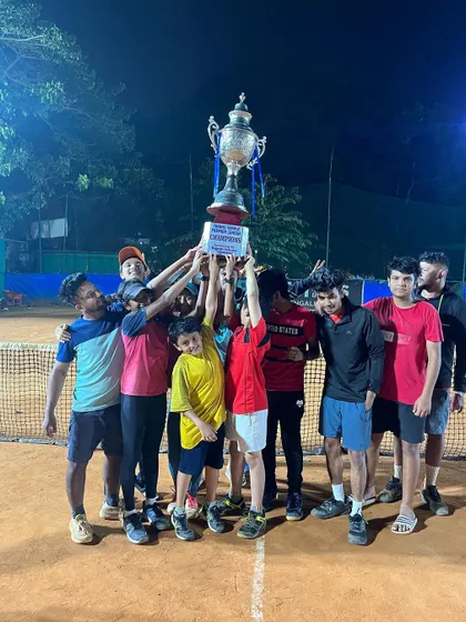 Another angle of the winning team from the December 2022 TTPL, proudly lifting the trophy together. These are the moments that players train and compete for.