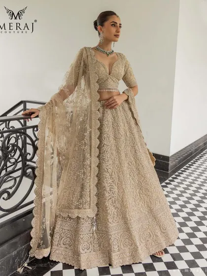 A full view of the golden lehenga, a silhouette that speaks of tradition, refined for the modern bride.