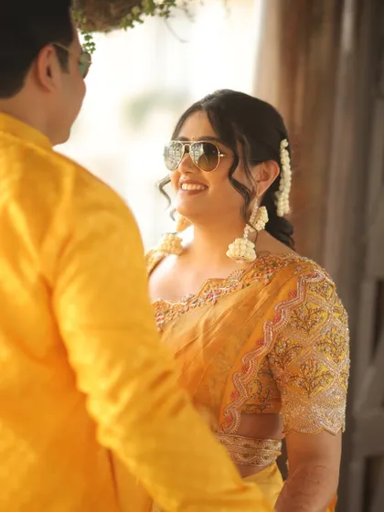 A sweet, candid moment between the couple, their smiles and loving gaze captured perfectly.